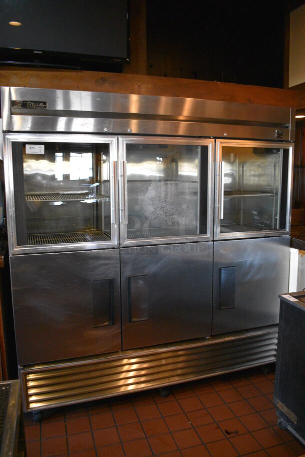 WOW! 2005 True Model TS-72-3-G-3 Stainless Steel Commercial 6 Half Size Door Reach In Cooler w/ Poly Coated Racks on Commercial Casters. 115 Volts, 1 Phase. 78x30x83
