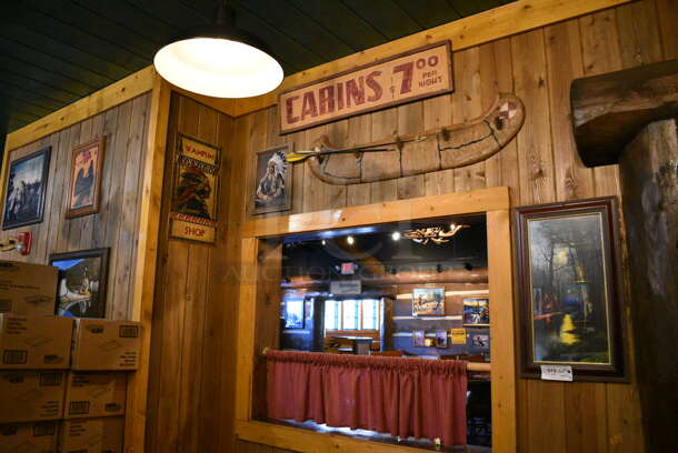 ALL ONE MONEY! Lot of Various Wall Decorations Including 9 Native American Decorations; Cabins Sign, Canoe Decor, Genuine Indian Souvenirs Sign, and Various Pictures! BUYER MUST REMOVE - Image 1 of 6