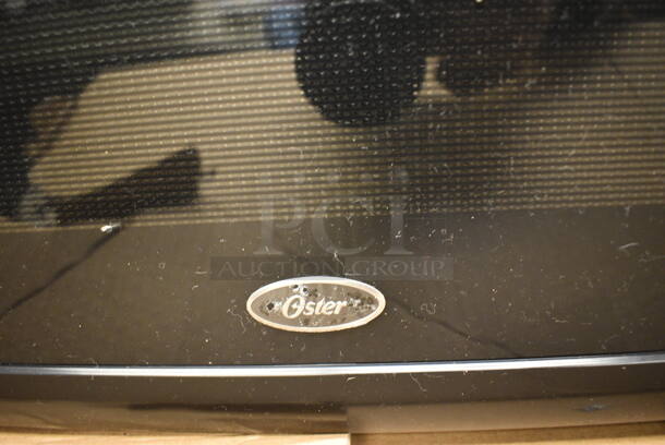 IN ORIGINAL BOX! Oster Countertop Microwave. 21x16x12 - Image 4 of 5