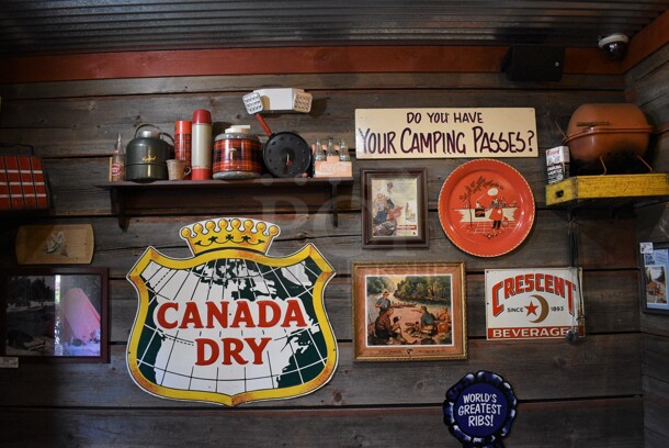 ALL ONE MONEY! Lot of Wall Decor; Shelf of Thermoses, Canada Dry Sign, Camping Passes Sign; Crescent Beverage Sign, Framed Pictures and Metal Grill! BUYER MUST REMOVE