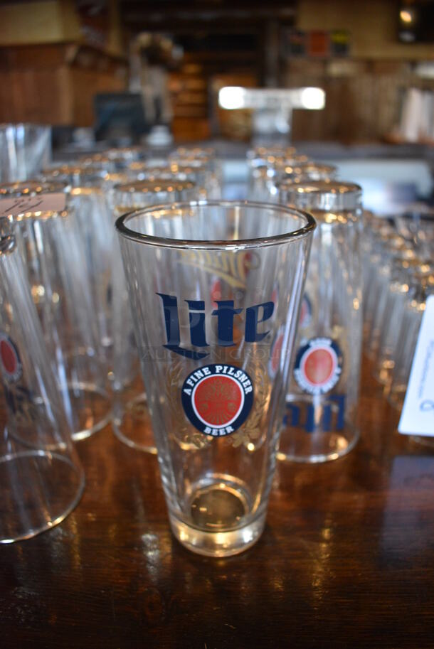 14 Miller Lite Beverage Glasses. 3.5x3.5x7. 14 Times Your Bid!