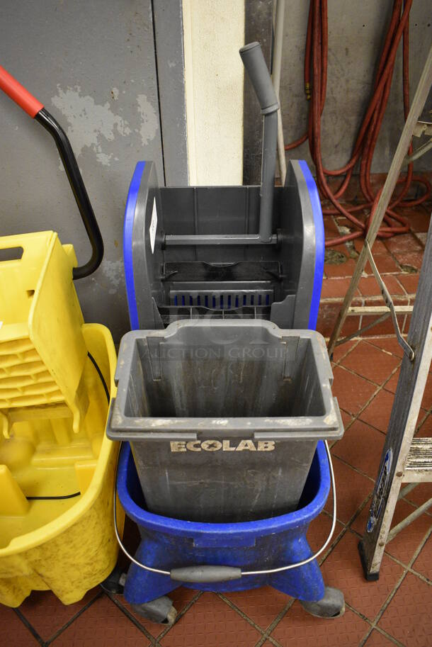 Ecolab Blue and Gray Poly Mop Bucket w/ Wringing Attachment on Commercial Casters. 15x21x39