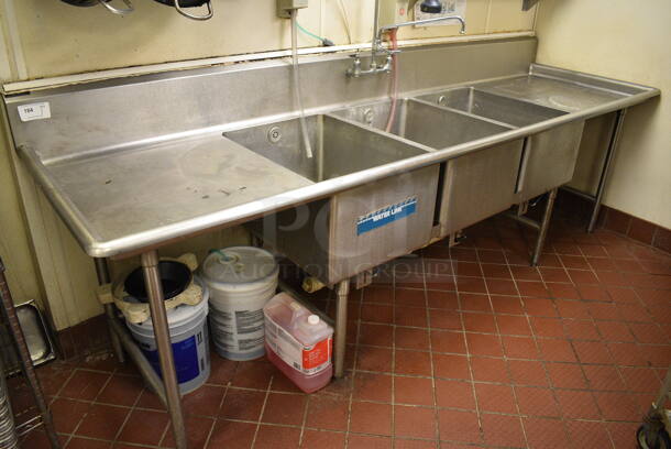 Stainless Steel Commercial 3 Bay Sink w/ Dual Drainboards, Faucet and Handles. BUYER MUST REMOVE. 120x35x43. Bays 20x28x14. Drainboards 27x31x2 - Image 1 of 5