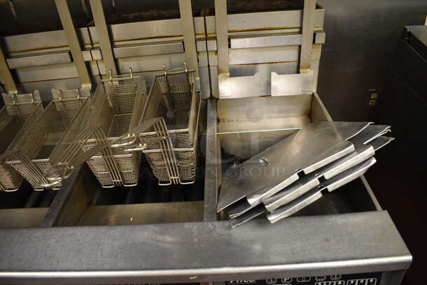 GORGEOUS! Pitco Frialator Stainless Steel Commercial Floor Style Gas Powered 4 Bay Deep Fat Fryer w/ Filtration System, 8 Metal Fry Baskets and 4 Metal Lids on Commercial Casters. 110,000 BTU. 62.5x39x55. Unit Was Working When Restaurant Closed! - Image 4 of 10