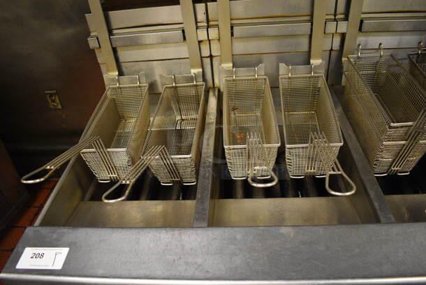 GORGEOUS! Pitco Frialator Stainless Steel Commercial Floor Style Gas Powered 4 Bay Deep Fat Fryer w/ Filtration System, 8 Metal Fry Baskets and 4 Metal Lids on Commercial Casters. 110,000 BTU. 62.5x39x55. Unit Was Working When Restaurant Closed! - Image 5 of 10
