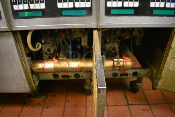 GORGEOUS! Pitco Frialator Stainless Steel Commercial Floor Style Gas Powered 4 Bay Deep Fat Fryer w/ Filtration System, 8 Metal Fry Baskets and 4 Metal Lids on Commercial Casters. 110,000 BTU. 62.5x39x55. Unit Was Working When Restaurant Closed! - Image 9 of 10