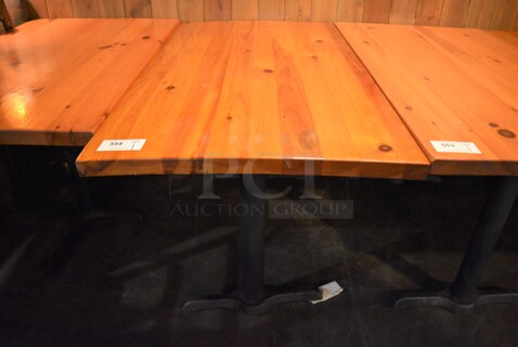 Wooden Tabletop on 2 Black Straight Leg Metal Table Bases. 53x30x30