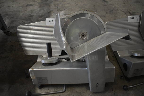 2006 Bizerba Model Se 12 US Stainless Steel Commercial Countertop Meat Slicer. 120 Volts, 1 Phase. 28x24x24. Cannot Test Due To Cut Power Cord