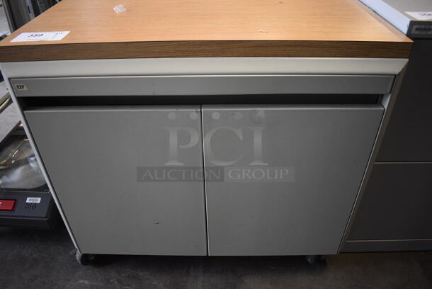 Tan Metal Cart w/ 2 Doors and Wood Pattern Counter on Commercial Casters. 30x25x27.5