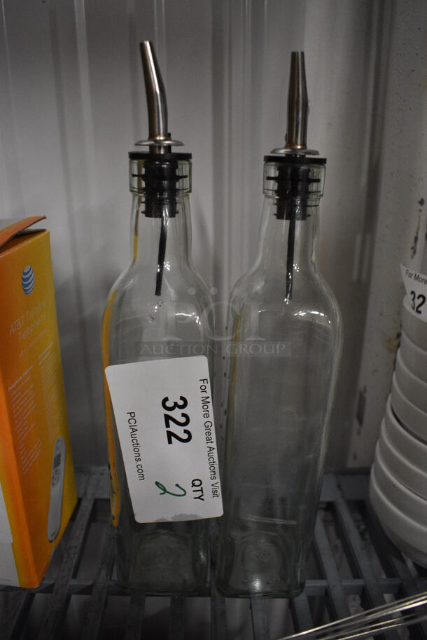 2 Glass Oil / Vinegar Bottles. 2x2x12. 2 Times Your Bid!