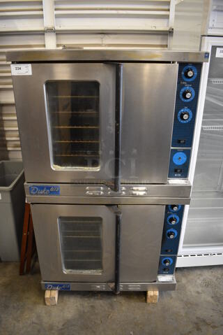2 BEAUTIFUL! Duke Stainless Steel Commercial Gas Powered Convection Ovens w/ Solid Door, View Through Door, Metal Oven Racks and Thermostatic Controls on Commercial Casters. 38x41x62. 2 Times Your Bid!