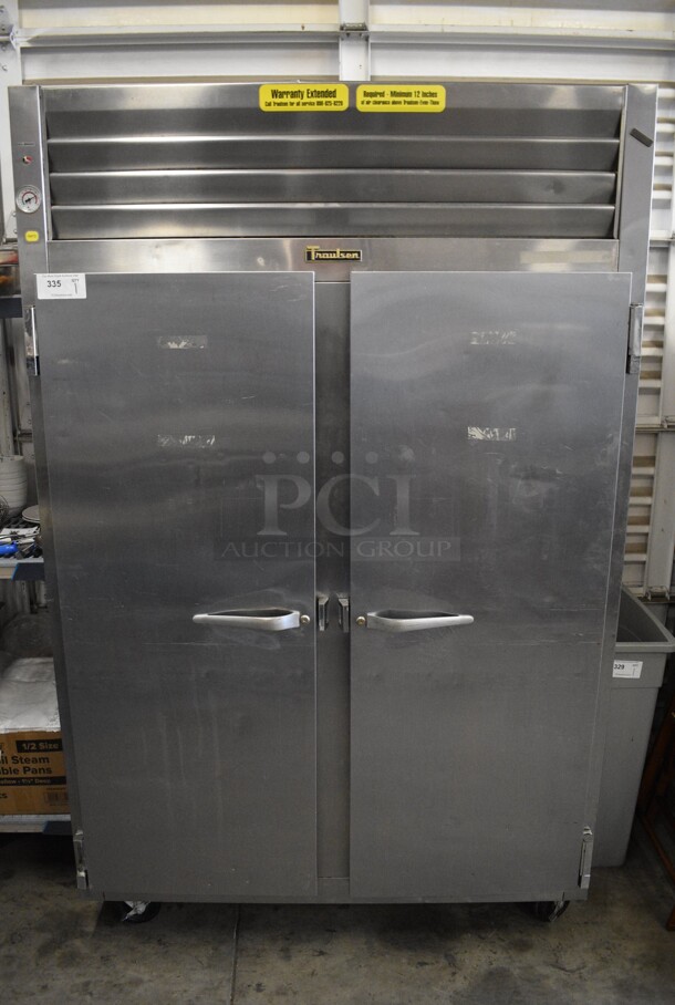 WOW! Traulsen Model RET232NUT-FHS Stainless Steel Commercial 2 Door Reach In Cooler on Commercial Casters. 115 Volts, 1 Phase. 52x35x83. Cannot Test Due To Plug Style