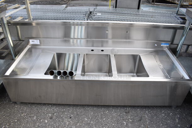 BRAND NEW! BK Stainless Steel Commercial 3 Bay Bar Sink w/ Dual Drainboards. Comes w/ 4 Legs! 60x22x17. Bays 10x14x10. Drainboards 11x19x1. Legs 21" - Image 1 of 6