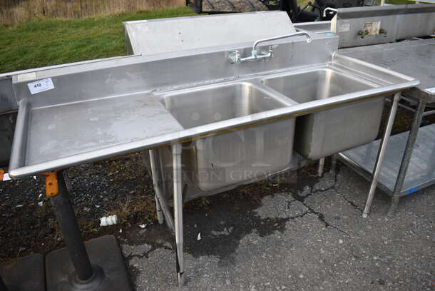 Stainless Steel Commercial 2 Bay Sink w/ Faucet, Handles and Left Side Drainboard. 72x27x40. Bays 20x20x12. Drainboard 22x23x2