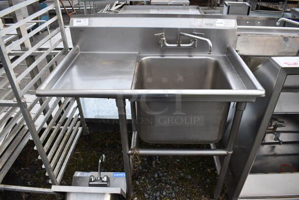 Stainless Steel Commercial Single Bay Sink w/ Faucet, Handles and Left Side Drainboard. 44x27x46. Bay 20x20x14. Drainboard 16x23x2