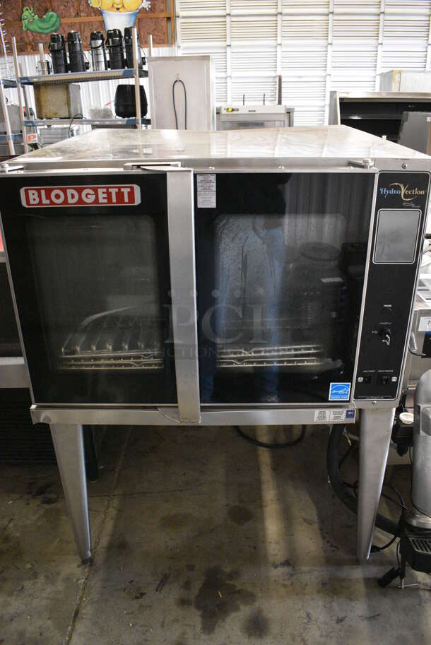 SWEET! Blodgett Model HV-100G ENERGY STAR Stainless Steel Commercial Gas Powered Full Size Convection Hydrovection Oven w/ View Through Doors and Metal Oven Racks on Metal Legs.