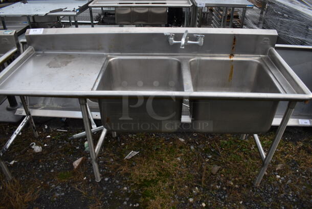 Stainless Steel Commercial 2 Bay Sink w/ Handles and Left Side Drainboard. 72x27x40. Bays 20x20x12. Drainboard 22x23x2 - Image 1 of 4
