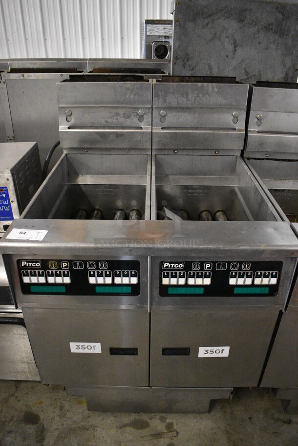FANTASTIC! 2011 Pitco Frialator Model SG14 Stainless Steel Commercial Floor Style Natural Gas Powered 2 Bay Deep Fat Fryer w/ Filtration System on Commercial Casters. 110,000 BTU. 31.5x34.5x46