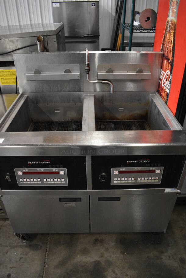 BEAUTIFUL! 2015 Henny Penny Model OFG-342 Stainless Steel Commercial Floor Style Natural Gas Powered 2 Bay Deep Fat Fryer on Commercial Casters. 240,000 BTU. 44x37x47