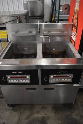 BEAUTIFUL! 2015 Henny Penny Model OFG-342 Stainless Steel Commercial Floor Style Natural Gas Powered 2 Bay Deep Fat Fryer on Commercial Casters. 240,000 BTU. 44x37x47