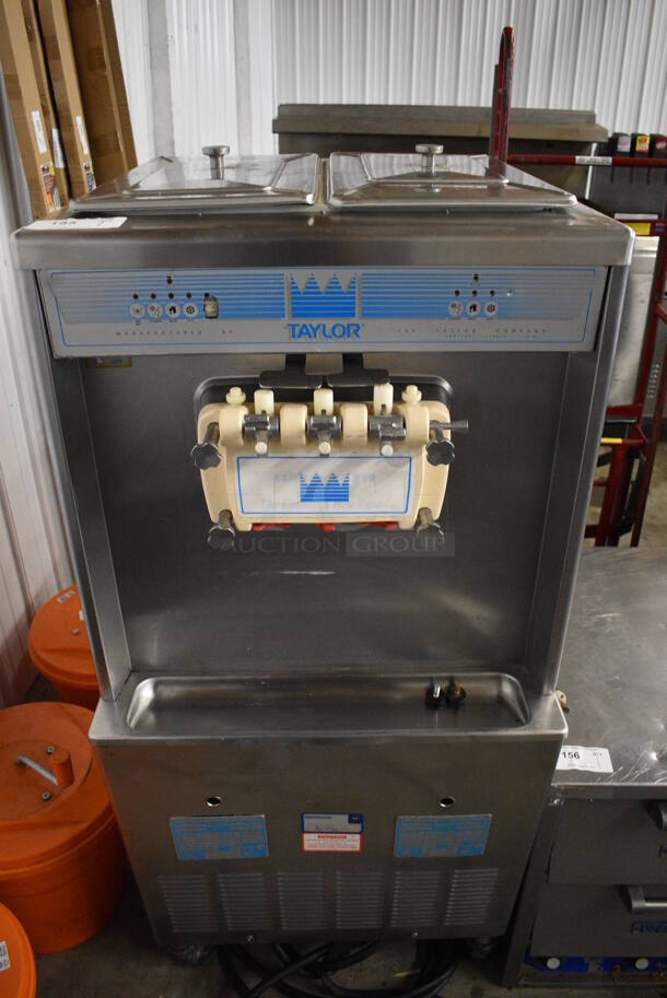 FANTASTIC! Taylor Model 754-27 Stainless Steel Commercial Floor Style Air Cooled 2 Flavor w/ Twist Soft Serve Ice Cream Machine on Commercial Casters. 208-230 Volts, 1 Phase. 26x33x60