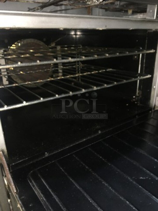 Amazing! Garland Natural Gas Powered 6 Burner Stove With 24 Inch Flat Grill Combo! With Double Full Size Convection Ovens Underneath! With Raised Stainless Steel Back Splash With Salamander Shelf! On Commercial Casters!  - Image 8 of 11
