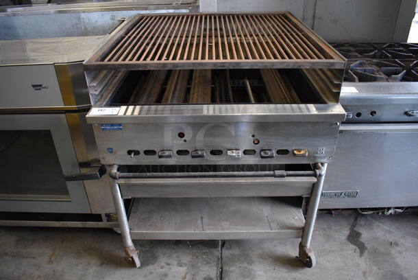 WOW! Jade Range Stainless Steel Commercial Countertop Gas Powered Charbroiler Grill w/ Stainless Steel Commercial Equipment Stand on Commercial Casters. 36x42x40.5 - Image 1 of 8