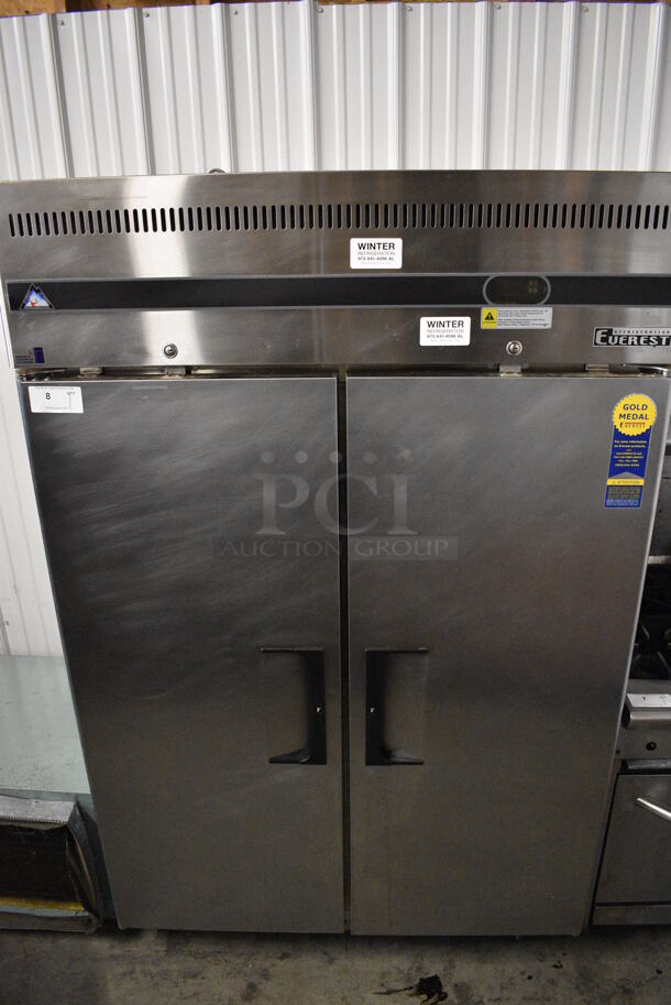 SWEET! Everest Model ESF2 Stainless Steel Commercial 2 Door Reach In Freezer w/ Poly Coated Racks on Commercial Casters. 115 Volts, 1 Phase. 49x32x79. Tested and Working!