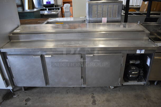 WOW! 2010 Kairak Model KBP-91S Stainless Steel Commercial Prep Table on Commercial Casters w/ Top Lid and 3 Doors. 115 Volts, 1 Phase. 91x32x37. Cannot Test Due To Plug Style