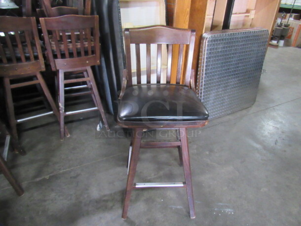 Wooden Bar Height Chair With Black Cushioned Swivel Seat And Footrest. 