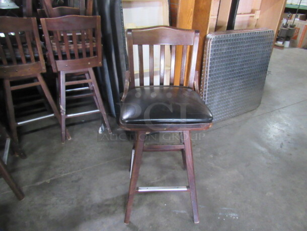 Wooden Bar Height Chair With Black Cushioned Swivel Seat And Footrest. 2XBID. - Image 1 of 3