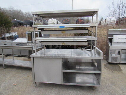 One GREAT Stainless Steel Work Table With 2 Stainless Under Shelves, 3 Stainless Over Shelves, 2 Ticket Rails, And 2 Marshall Heat Lamps. 208 Volt. 66X36X76.5