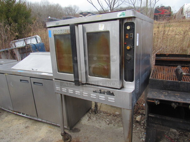 One Blodgett Natural Gas Full Size Convection Oven, With 4 Racks, On Casters. #04046R70075. 38X40X62
