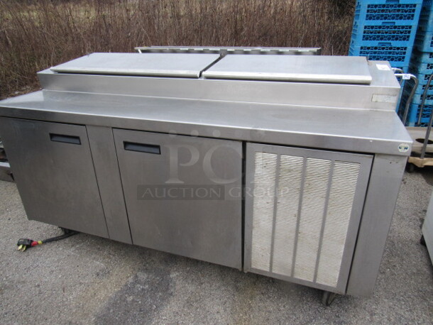 One SS Delfield 2 Door Prep Table On Casters. Model# F18FC78, 115 Volt. 76X31.5X44. Working. 