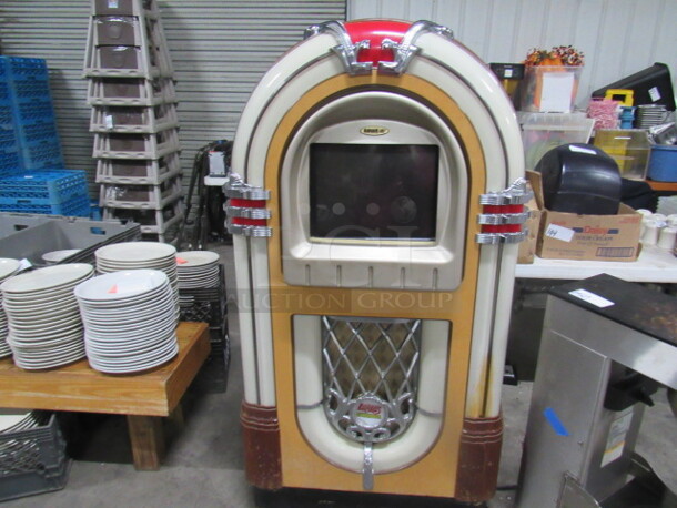 One Rowe AMI Juke Box With Key. Model# CD-RN. 120 Volt. 34X27X62. WORKING!!!