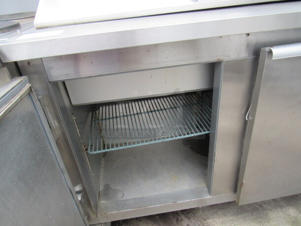 One Delfield 3 Door Prep Table, With 2 Racks,  On Casters. 72X32X45. Working Not Cold. - Image 2 of 2