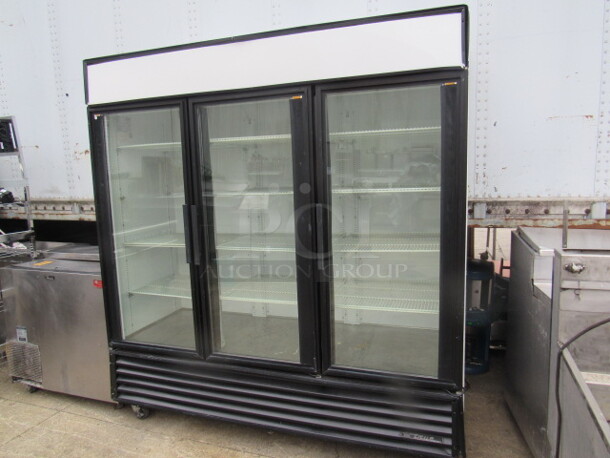 COLD COLD COLD!!! One True 3 Door Glass Lighted Display Cooler With 11 Racks.  Model# GDM-72. 115 Volt. 77X30X83. Working And Cold.