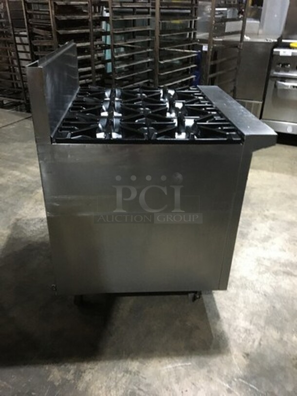 Garland Commercial Natural Gas Powered 6 Burner Stove! With Storage Space Underneath! With Backsplash! All Stainless Steel! Model U366S Serial 1501100101834! On Commercial Casters!
 - Image 2 of 11