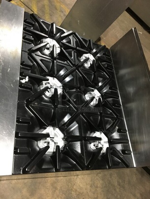 Garland Commercial Natural Gas Powered 6 Burner Stove! With Storage Space Underneath! With Backsplash! All Stainless Steel! Model U366S Serial 1501100101834! On Commercial Casters!
 - Image 5 of 11