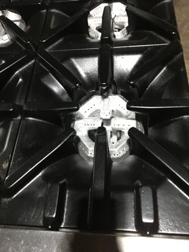 Garland Commercial Natural Gas Powered 6 Burner Stove! With Storage Space Underneath! With Backsplash! All Stainless Steel! Model U366S Serial 1501100101834! On Commercial Casters!
 - Image 6 of 11