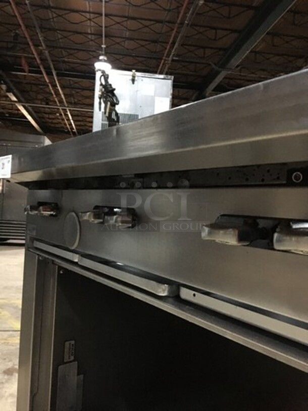 Garland Commercial Natural Gas Powered 6 Burner Stove! With Storage Space Underneath! With Backsplash! All Stainless Steel! Model U366S Serial 1501100101834! On Commercial Casters!
 - Image 10 of 11