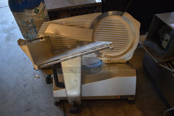 Univex Model 7512 Stainless Steel Commercial Countertop Meat Slicer. 115 Volts, 1 Phase. 25x20x17. Tested and Working!