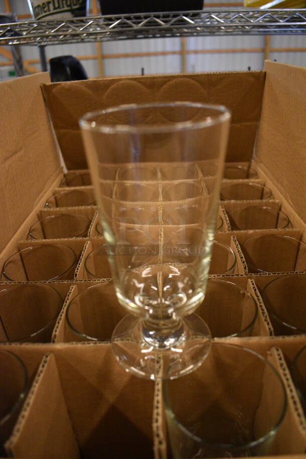24 BRAND NEW IN BOX! Footed Beverage Glasses. 3x3x6. 24 Times Your Bid! - Image 1 of 3