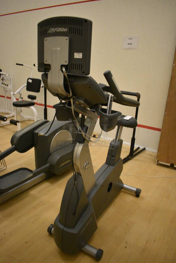 Life Fitness Metal Commercial Floor Style Upright Stationary Bicycle w/ Life Fitness Monitor. BUYER MUST REMOVE. 24x48x63. Working Condition Is Not Known. (behind squash court - right) - Image 7 of 7