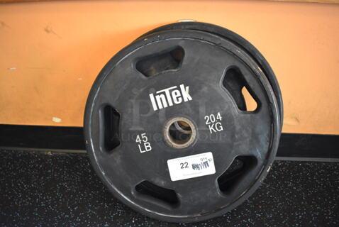 2 Intek Metal 45 Pound Weight Plates. BUYER MUST REMOVE. 17.5x17.5x2. 2 Times Your Bid! (upstairs)