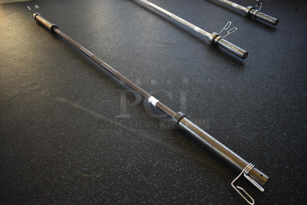 Metal Olympic Bar w/ 2 Spring Collars. 86". (upstairs) - Image 1 of 4