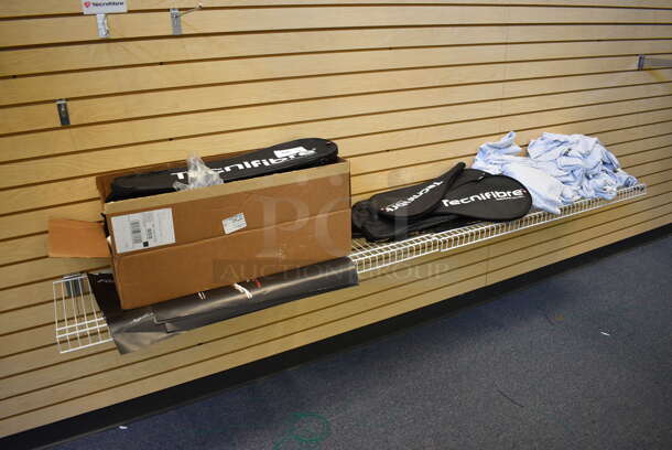 ALL ONE MONEY! Lot of Squash Racket Cases and Tshirts on White Rack! BUYER MUST REMOVE. (lobby - front room to the side)