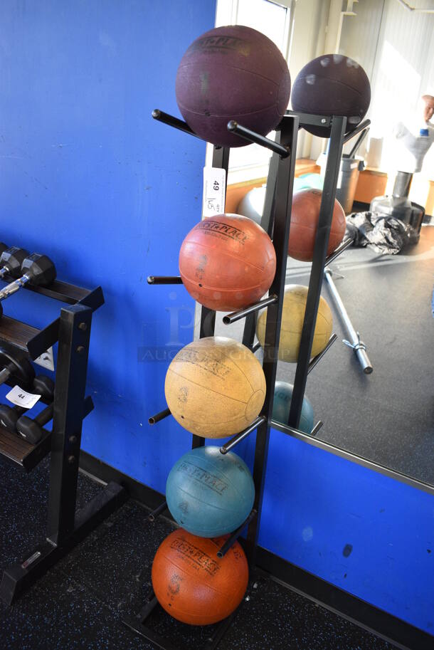 5 First Place Medicine Balls; 2.2 Pound, 4.4 Pound, 6.6 Pound, 8.8 Pound, 11 Pound on Black Metal 5 Tier Medicine Ball Rack. 11x14.5x52. (upstairs)
 - Image 2 of 5
