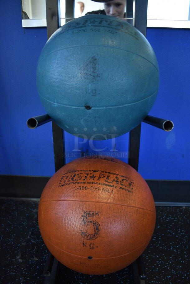 5 First Place Medicine Balls; 2.2 Pound, 4.4 Pound, 6.6 Pound, 8.8 Pound, 11 Pound on Black Metal 5 Tier Medicine Ball Rack. 11x14.5x52. (upstairs)
 - Image 5 of 5