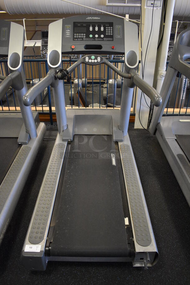 NICE! Life Fitness Model 95Ti Metal Heavy Duty Commercial Floor Style Treadmill w/ Heart Rate Sensors. 120 Volts, 1 Phase. BUYER MUST REMOVE. 36x84x65. Tested and Working! (upstairs) This Unit Will Be Moved Down To The First Floor Before Pick Up Day Begins!